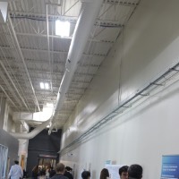People looking at projects in the Innovation Design Center.